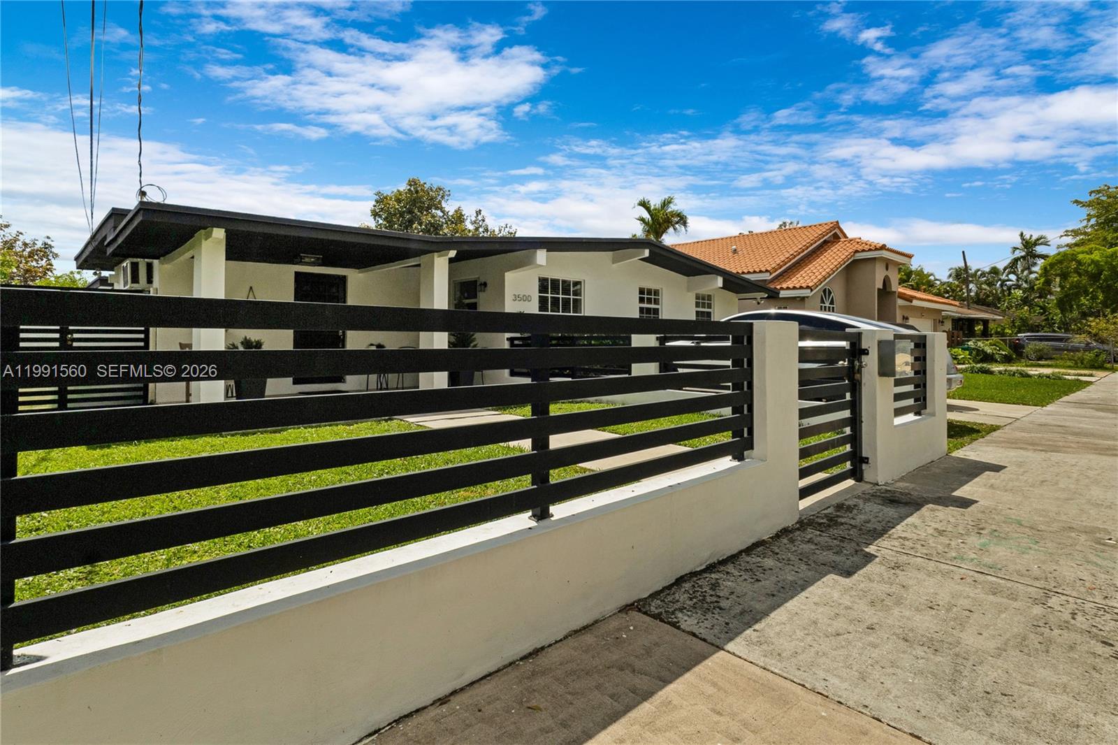 3500 Southwest 13th Street Miami, FL 33145 - Photo 9 of 51 a view of a big house with a balcony