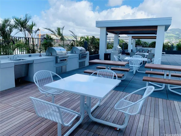 a outdoor living space with furniture and wooden floor