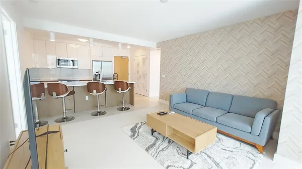 a living room with furniture and a table