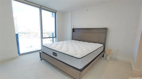 a room with a bed and a window