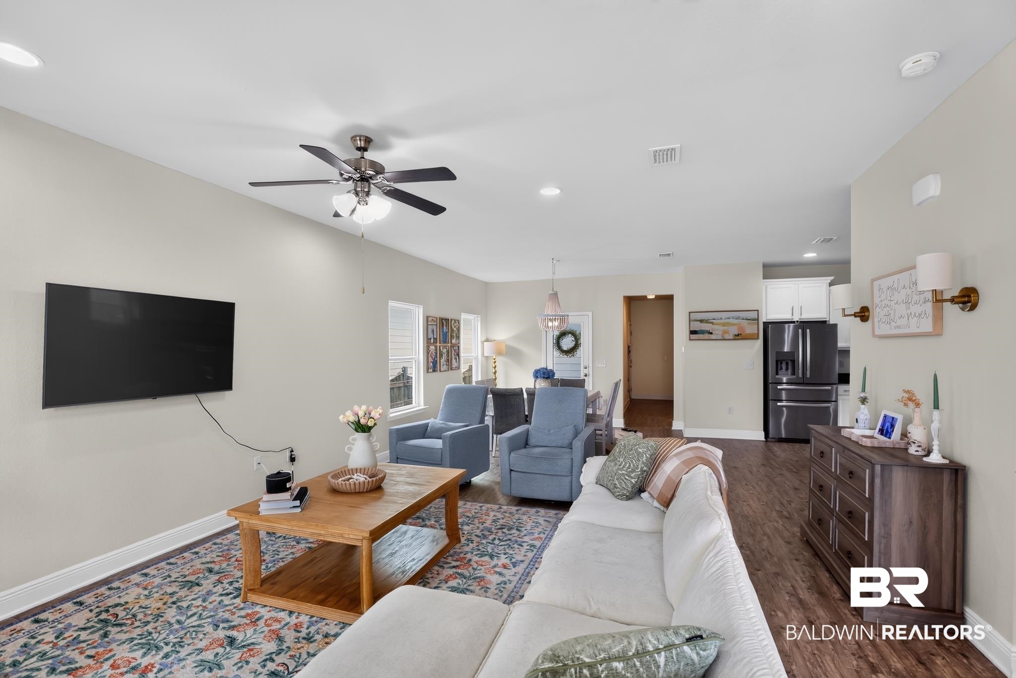 1210 Primrose Lane Foley, AL 36535 - Photo 9 of 33 Open-concept living space featuring wood-finish flooring, a ceiling fan, recessed lighting, and light-toned walls