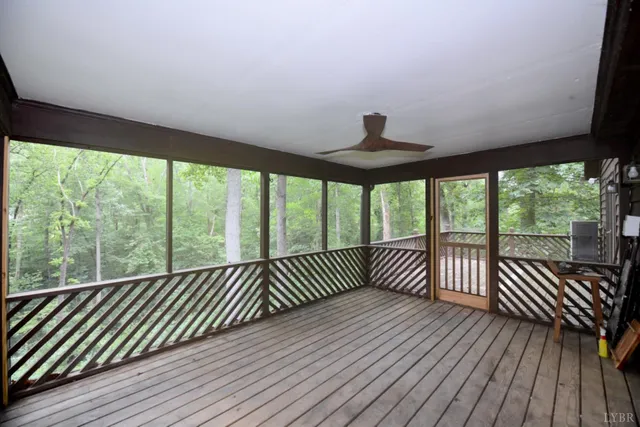 a view of a balcony with wooden floor