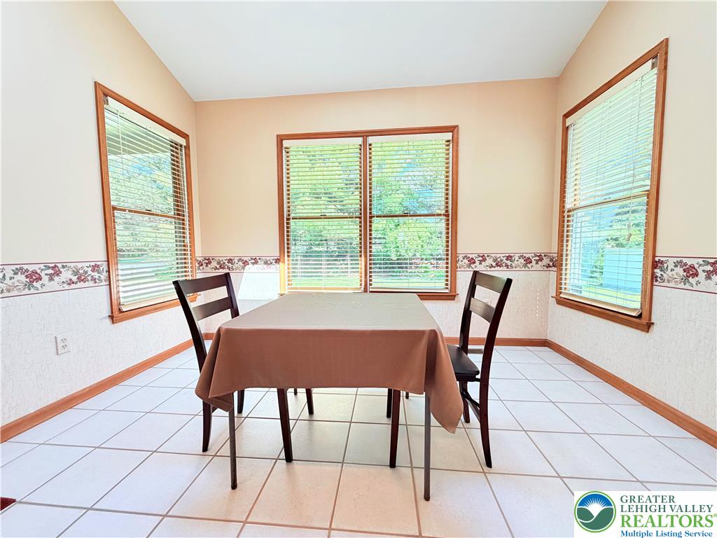 4165 Alder Road Bethlehem, PA 18020 - Photo 13 of 42 a view of a dining room with furniture and a window