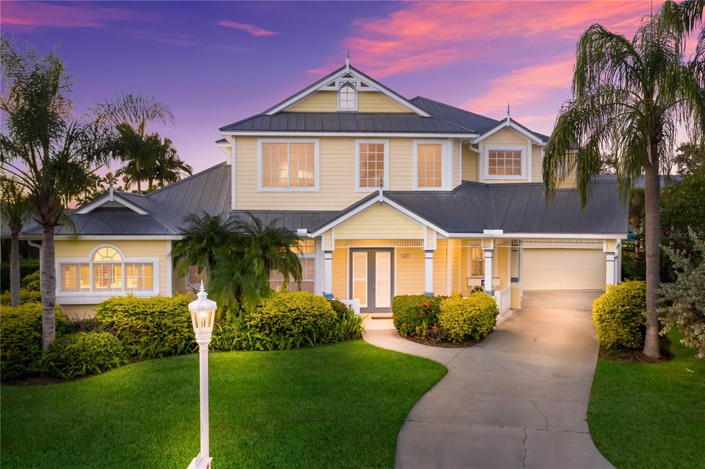 4627 Barracuda Drive Bradenton, FL 34208 - Photo 1 of 1 a front view of a house with a yard and potted plants