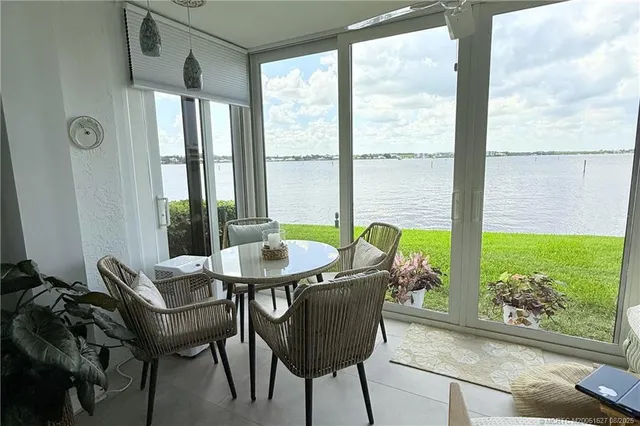 a bedroom with a bed couch and window