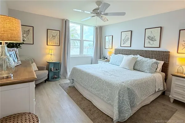 a bedroom with bed and window