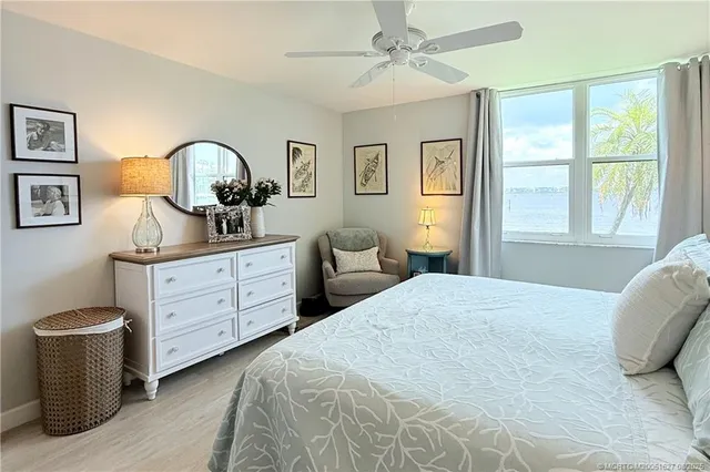 a view of a balcony with wooden floor and windows