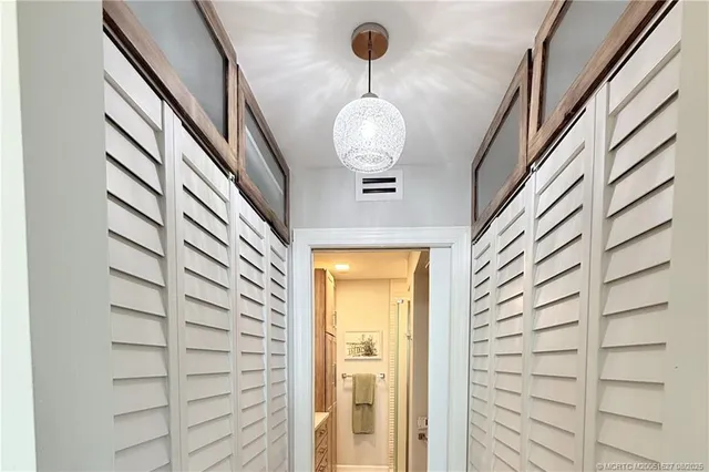 a bathroom with a double vanity sink and mirror