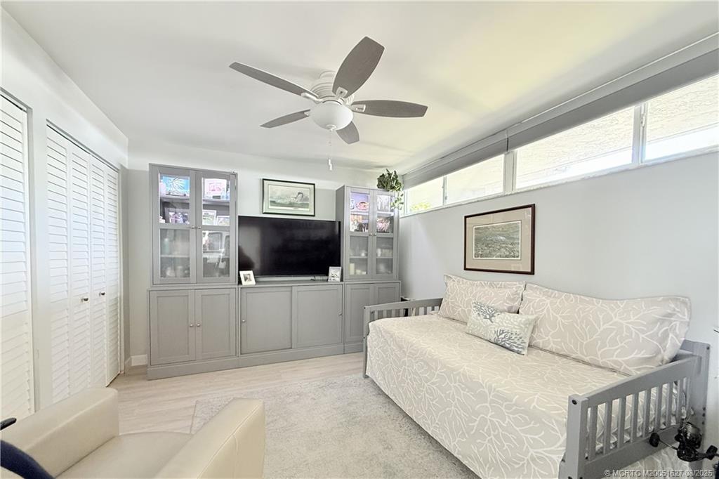 1950 Southwest Palm City Road, Unit 14101 Stuart, FL 34994 - Photo 33 of 36 a living room with furniture and a flat screen tv