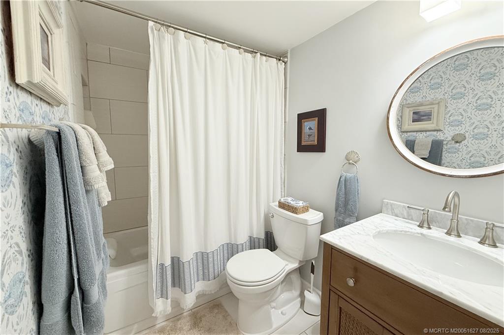 1950 Southwest Palm City Road, Unit 14101 Stuart, FL 34994 - Photo 34 of 36 a bathroom with a sink toilet and shower