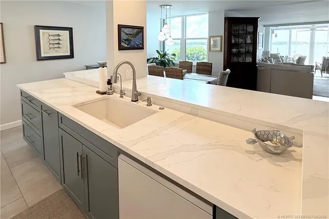 a kitchen with a sink a stove and refrigerator