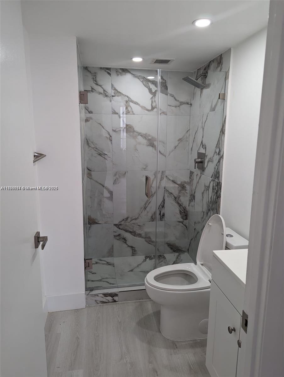 2801 Northeast 183rd Street, Unit 1709W Aventura, FL 33160 - Photo 4 of 6 a bathroom with a toilet and a shower