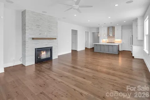 a view of a kitchen with a sink and a fireplace