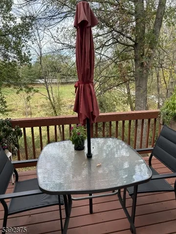a view of a balcony with a table and chairs