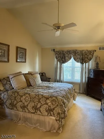 a bedroom with a bed and a night stand