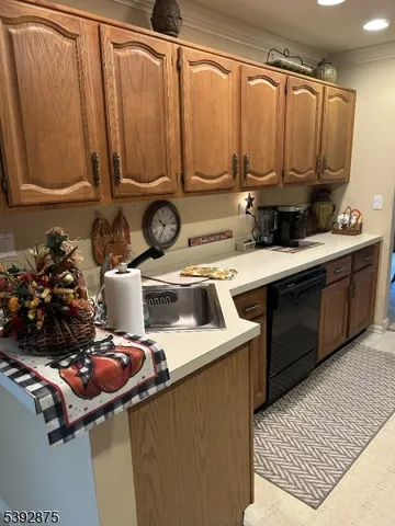 a kitchen with a sink appliances and cabinets