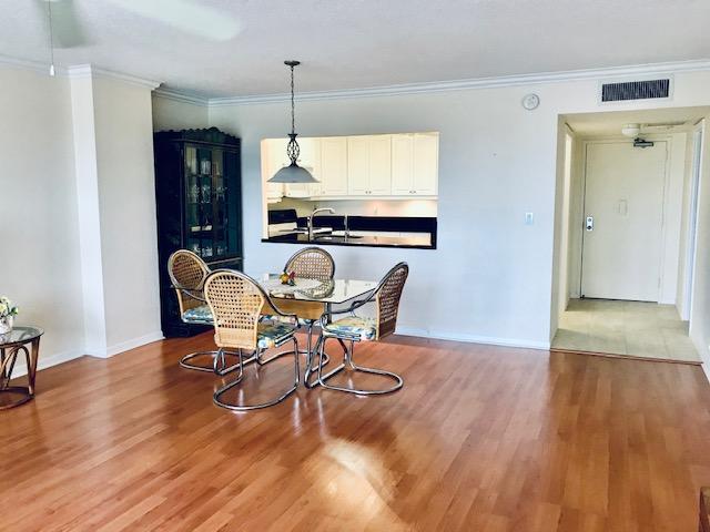 10777 West Sample Road, Unit 610 Coral Springs, FL 33065 - Photo 1 of 23 View to Kitchen from Dining Area