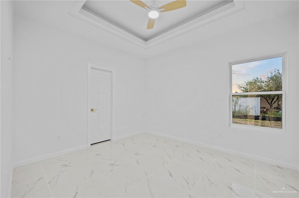 2732 East Conroe Road Edinburg, TX 78542 - Photo 12 of 15 a view of an empty room with a window
