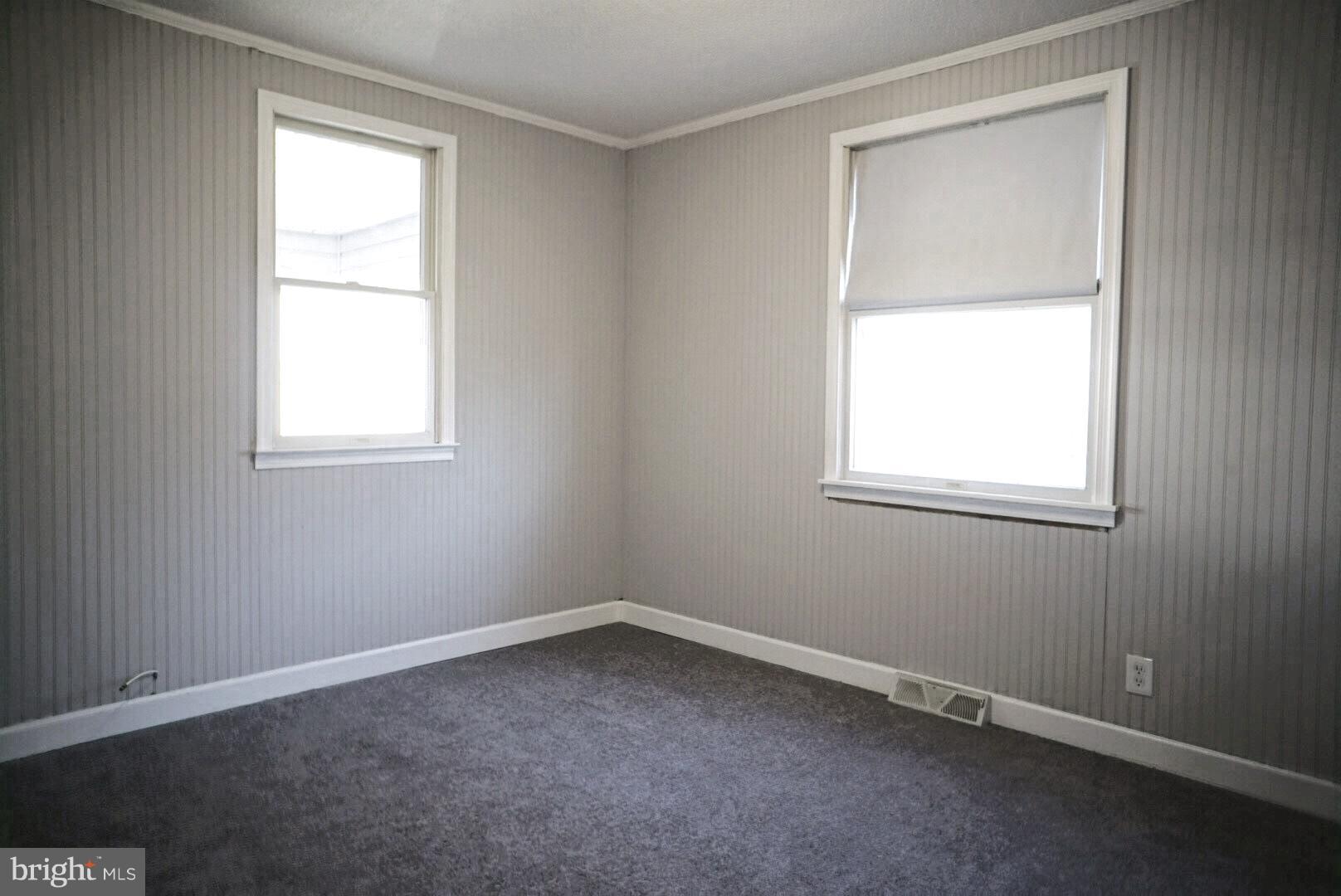 8244 Cornwall Road Baltimore, MD 21222 - Photo 12 of 30 an empty room with a window