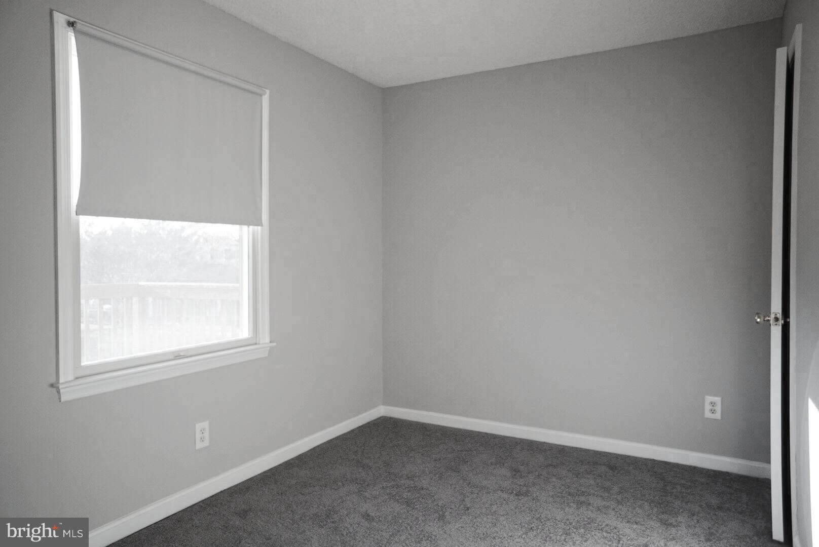 8244 Cornwall Road Baltimore, MD 21222 - Photo 14 of 30 an empty room with a window