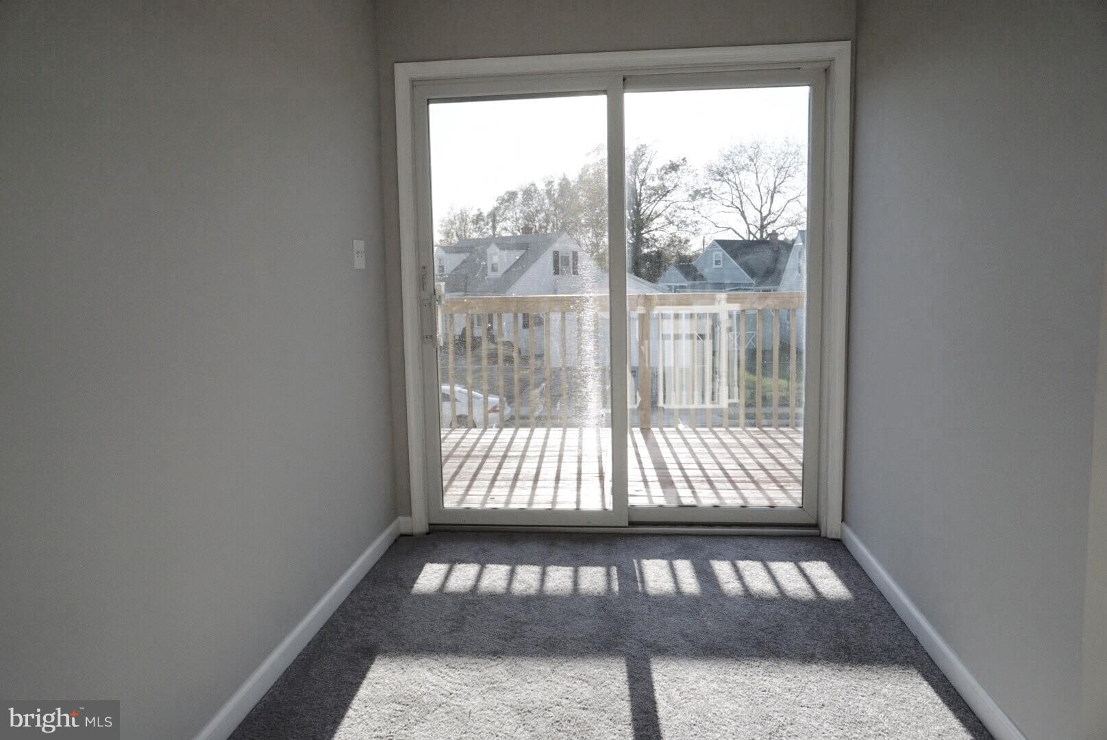 8244 Cornwall Road Baltimore, MD 21222 - Photo 15 of 30 a view of a porch with a bench