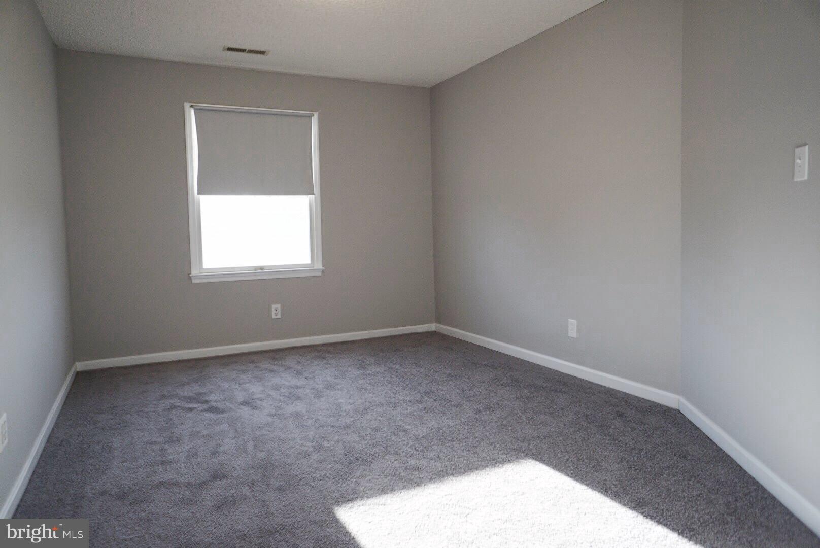 8244 Cornwall Road Baltimore, MD 21222 - Photo 18 of 30 an empty room with a window