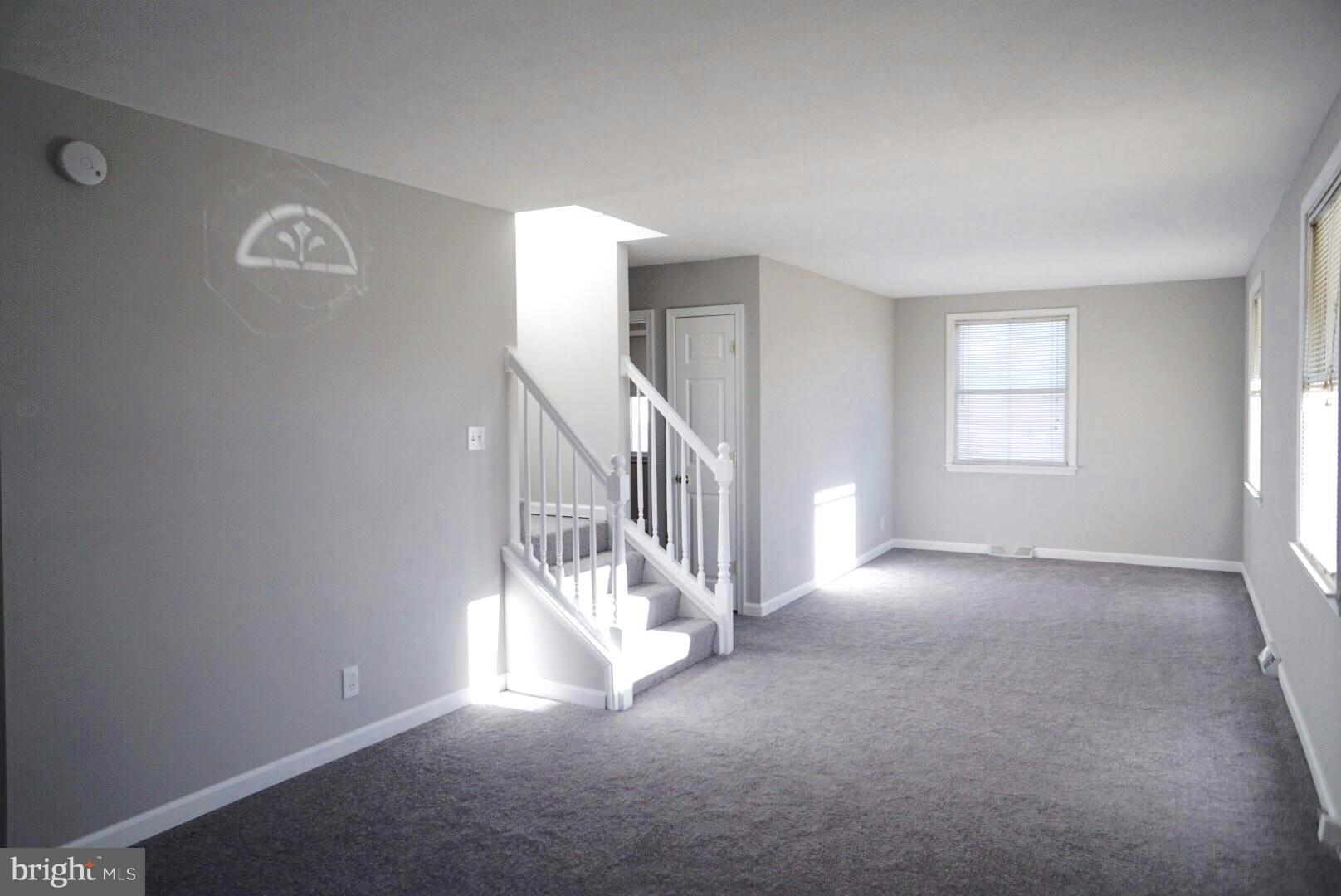 8244 Cornwall Road Baltimore, MD 21222 - Photo 3 of 30 a view of a livingroom with a staircase