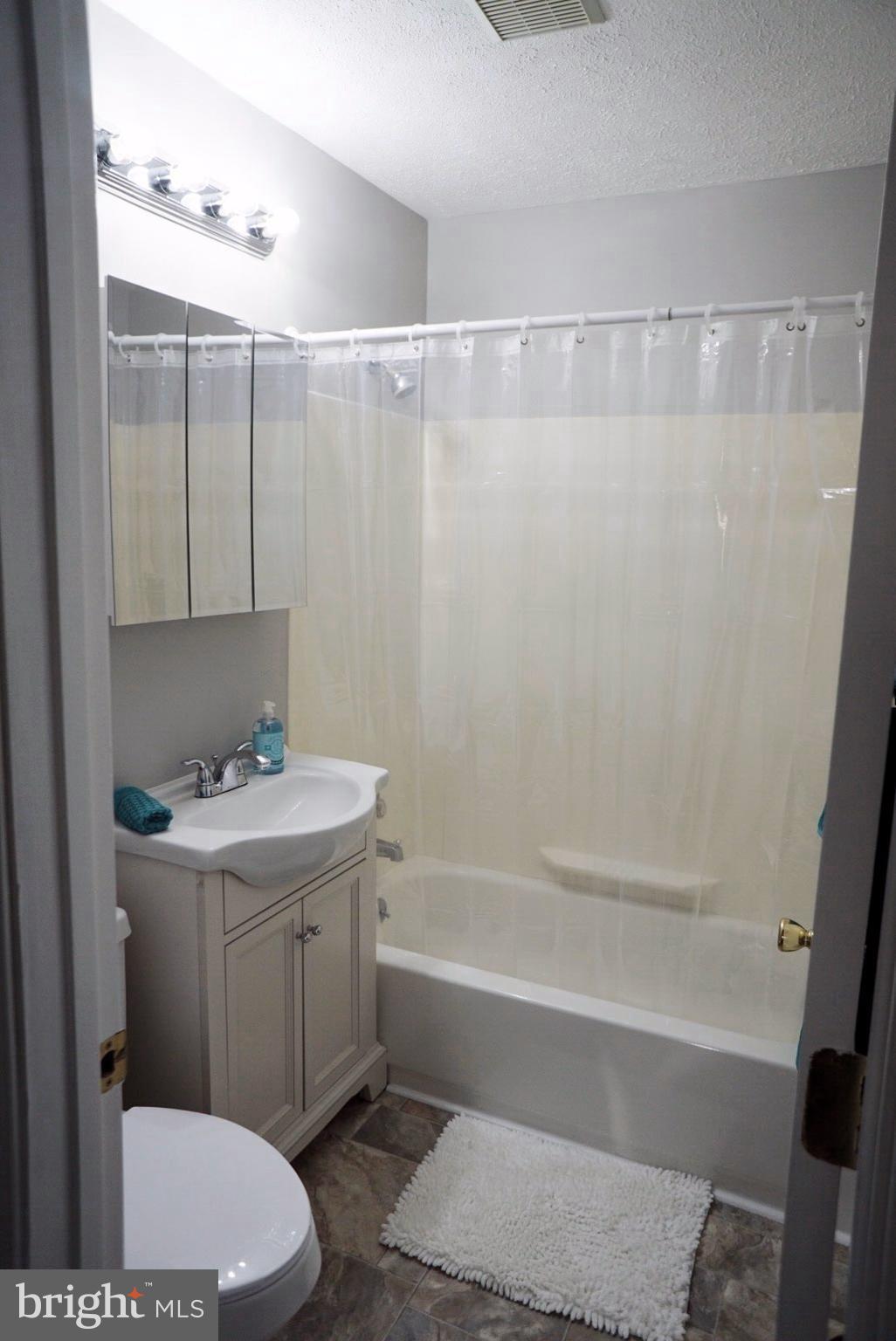 8244 Cornwall Road Baltimore, MD 21222 - Photo 9 of 30 a bathroom with a sink a toilet and shower