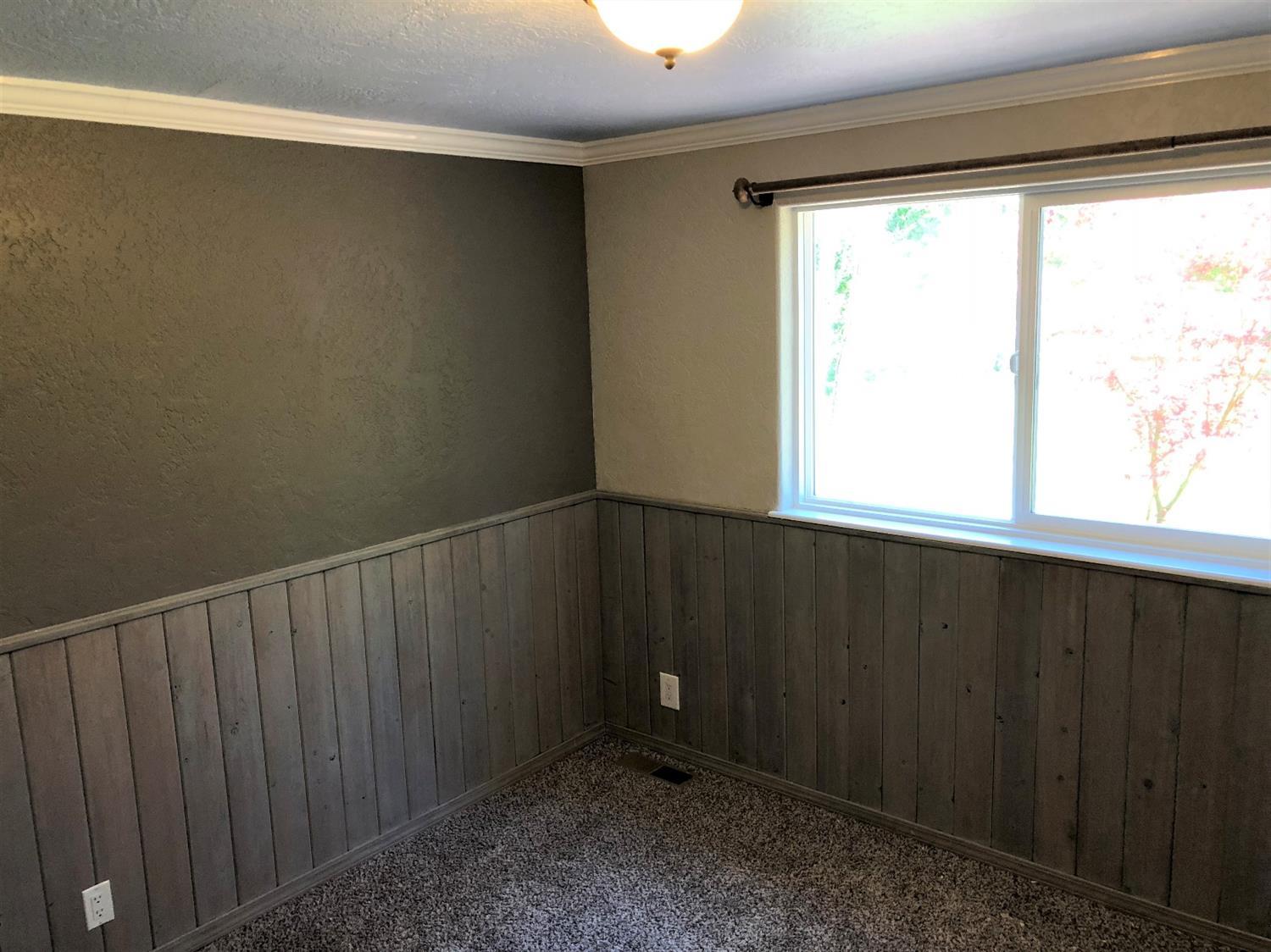 1560 Hugo Road Merlin, OR 97532 - Photo 16 of 29 a view of an empty room with a window