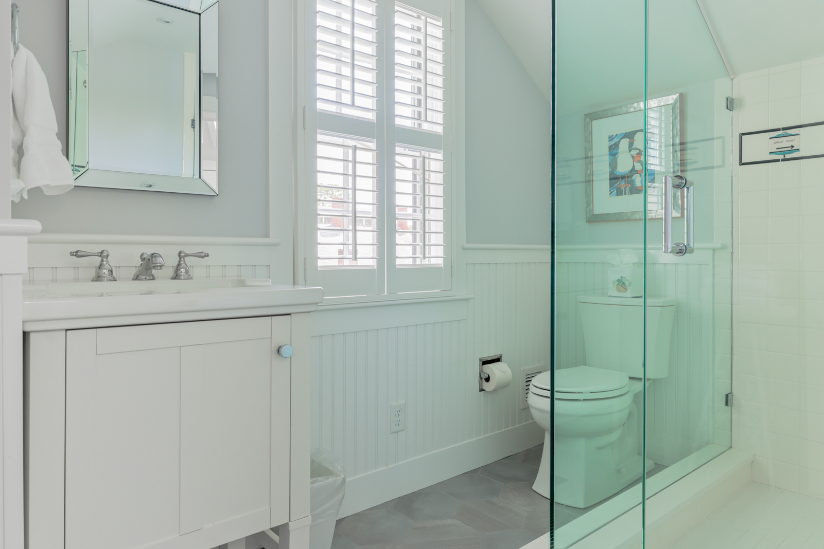 12 Hussey Street Nantucket, MA 02554 - Photo 32 of 47 a bathroom with a shower sink and mirror
