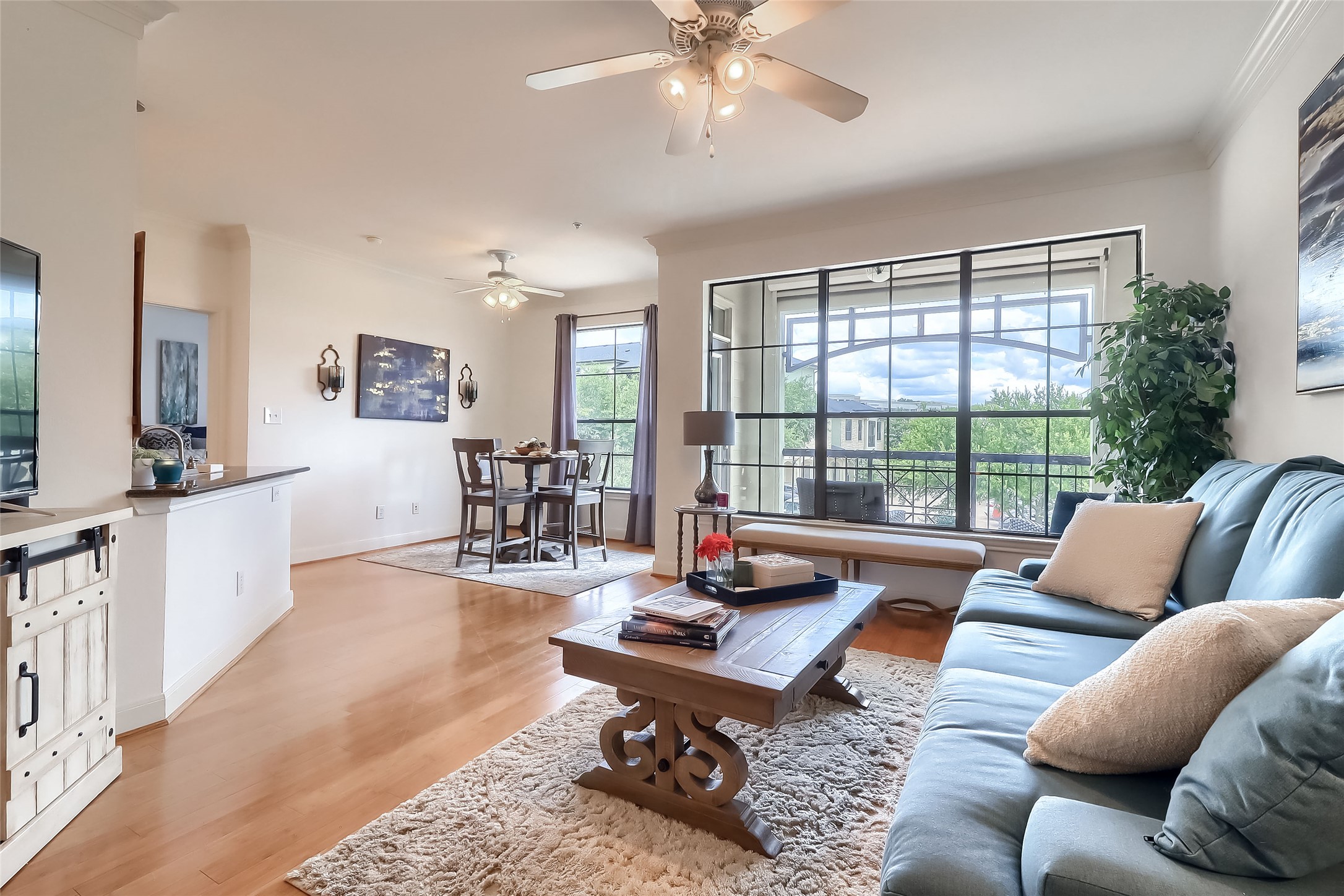 7701 Rialto Boulevard, Unit 1128 Austin, TX 78735 - Photo 4 of 35 a living room with furniture and a large window