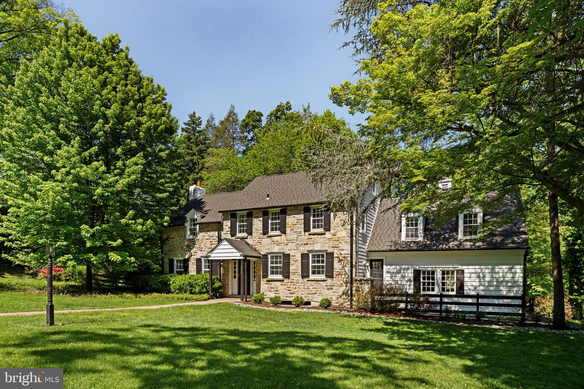 600 Mulford Road Wyncote, PA 19038 - Photo 1 of 88 a front view of a house with a garden