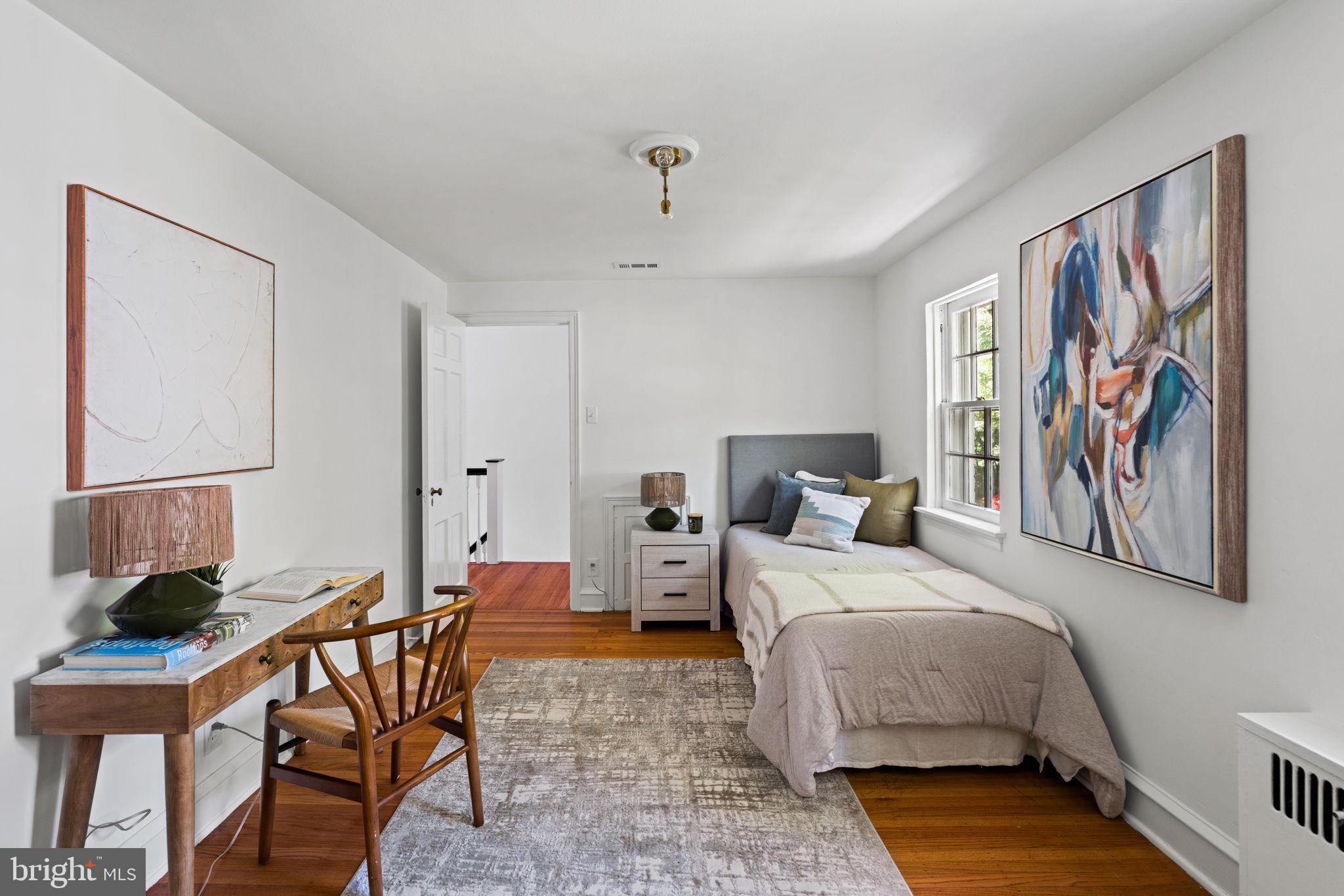 600 Mulford Road Wyncote, PA 19038 - Photo 61 of 88 a bed room with a bed and a painting on the wall