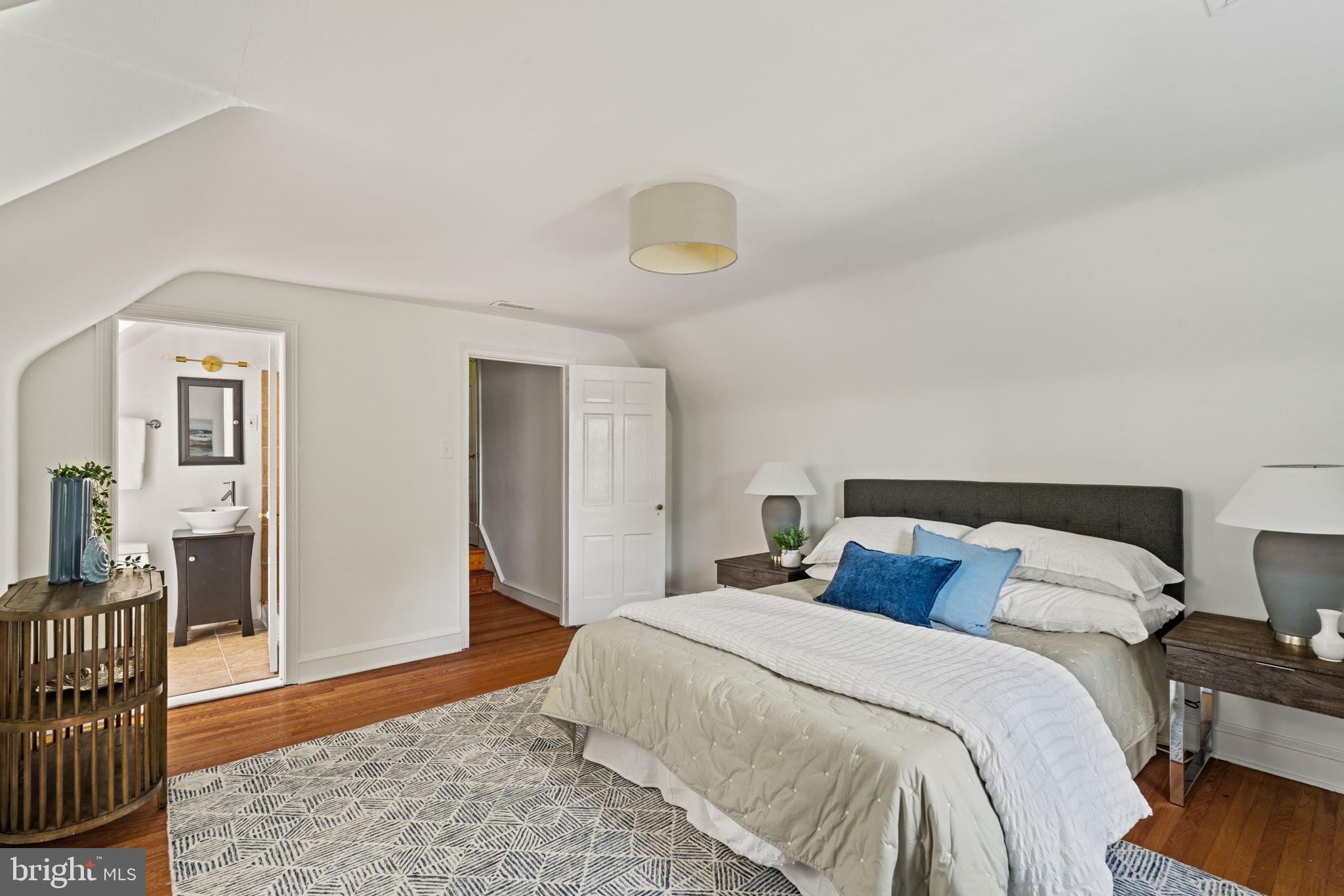 600 Mulford Road Wyncote, PA 19038 - Photo 66 of 88 a bedroom with a bed and wooden floor