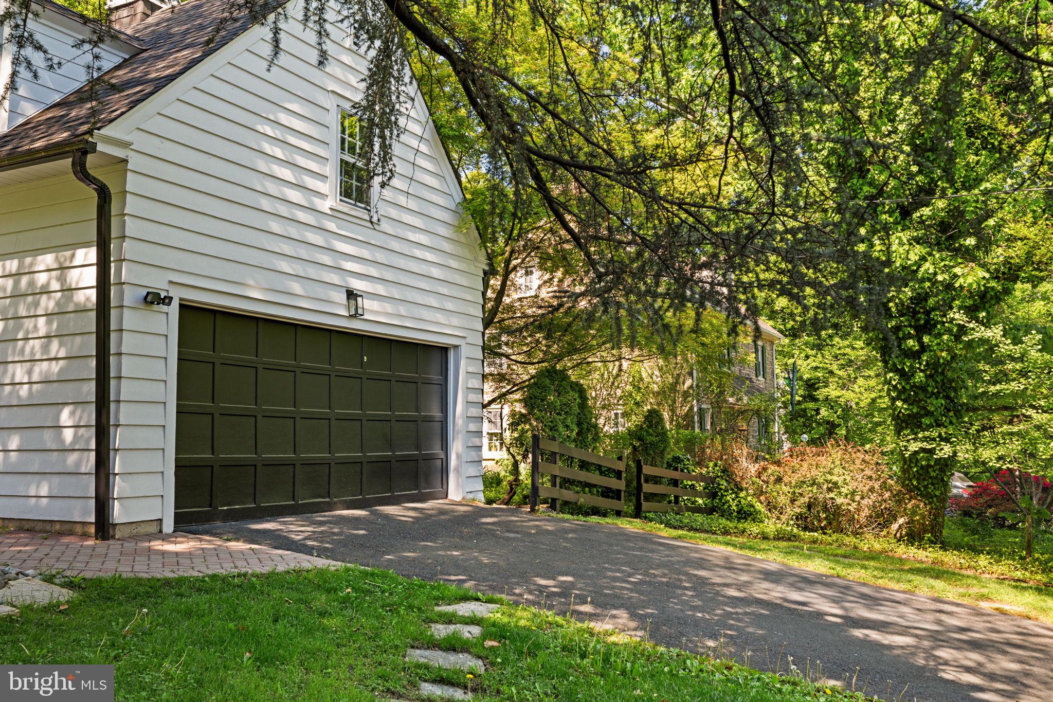 600 Mulford Road Wyncote, PA 19038 - Photo 86 of 88 a front view of a house with a yard and garage