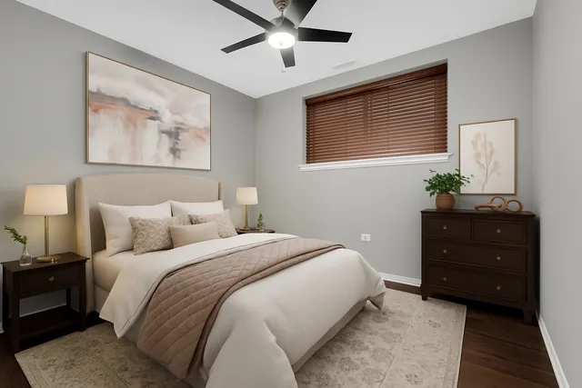 a bedroom with a bed and ceiling fan