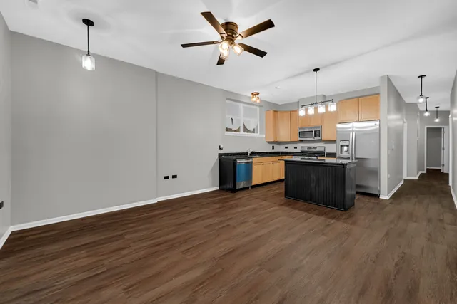 a view of kitchen with sink microwave and stove