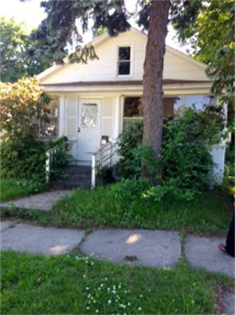 94 Barber Street Springfield, MA 01109 - Photo 1 of 1 a front view of a house with garden