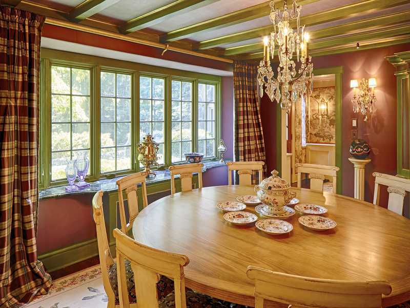 44 Glenville Road Greenwich, CT 06831 - Photo 11 of 25 a view of a dining room with furniture a chandelier and large windows