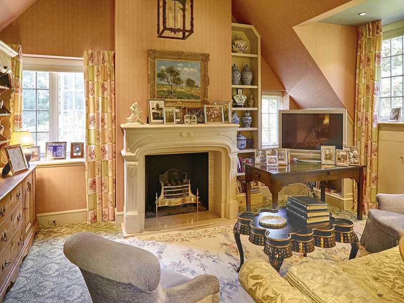 44 Glenville Road Greenwich, CT 06831 - Photo 13 of 25 a living room with furniture a flat screen tv and a fireplace