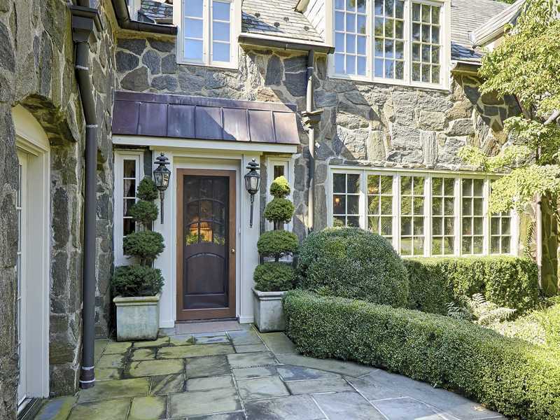 44 Glenville Road Greenwich, CT 06831 - Photo 2 of 25 front view of a brick house with a large windows