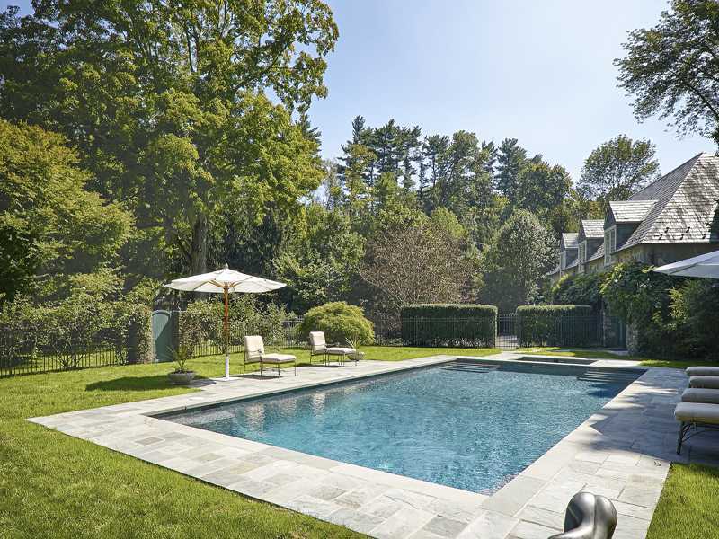 44 Glenville Road Greenwich, CT 06831 - Photo 24 of 25 a view of a swimming pool with a patio