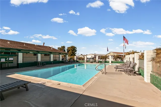 a view of a livingroom with furniture and a flat screen tv