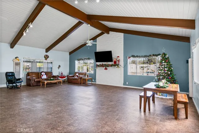 a view of a livingroom with furniture and window