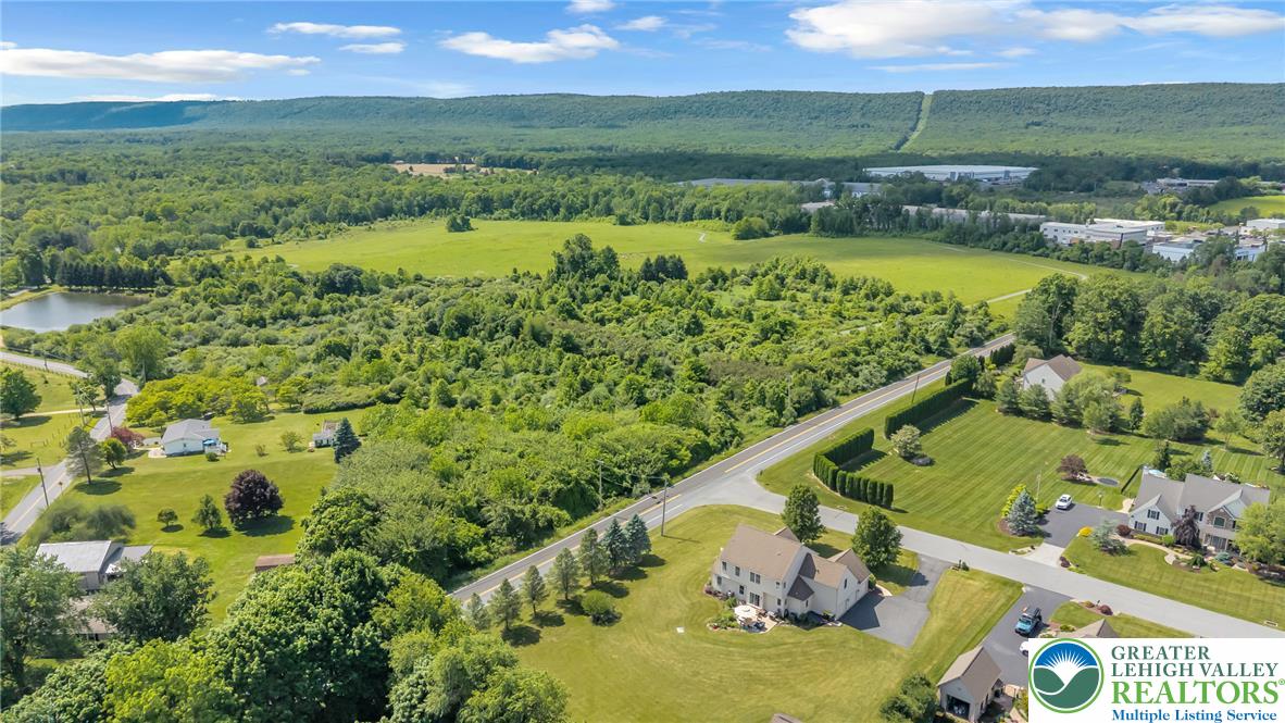 204 Bushkill Ridge Road Wind Gap, PA 18091 - Photo 47 of 48 An aerial perspective reveals a serene community nestled amidst rolling hills and abundant greenery.