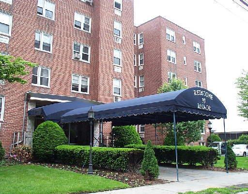 a view of a building with a garden