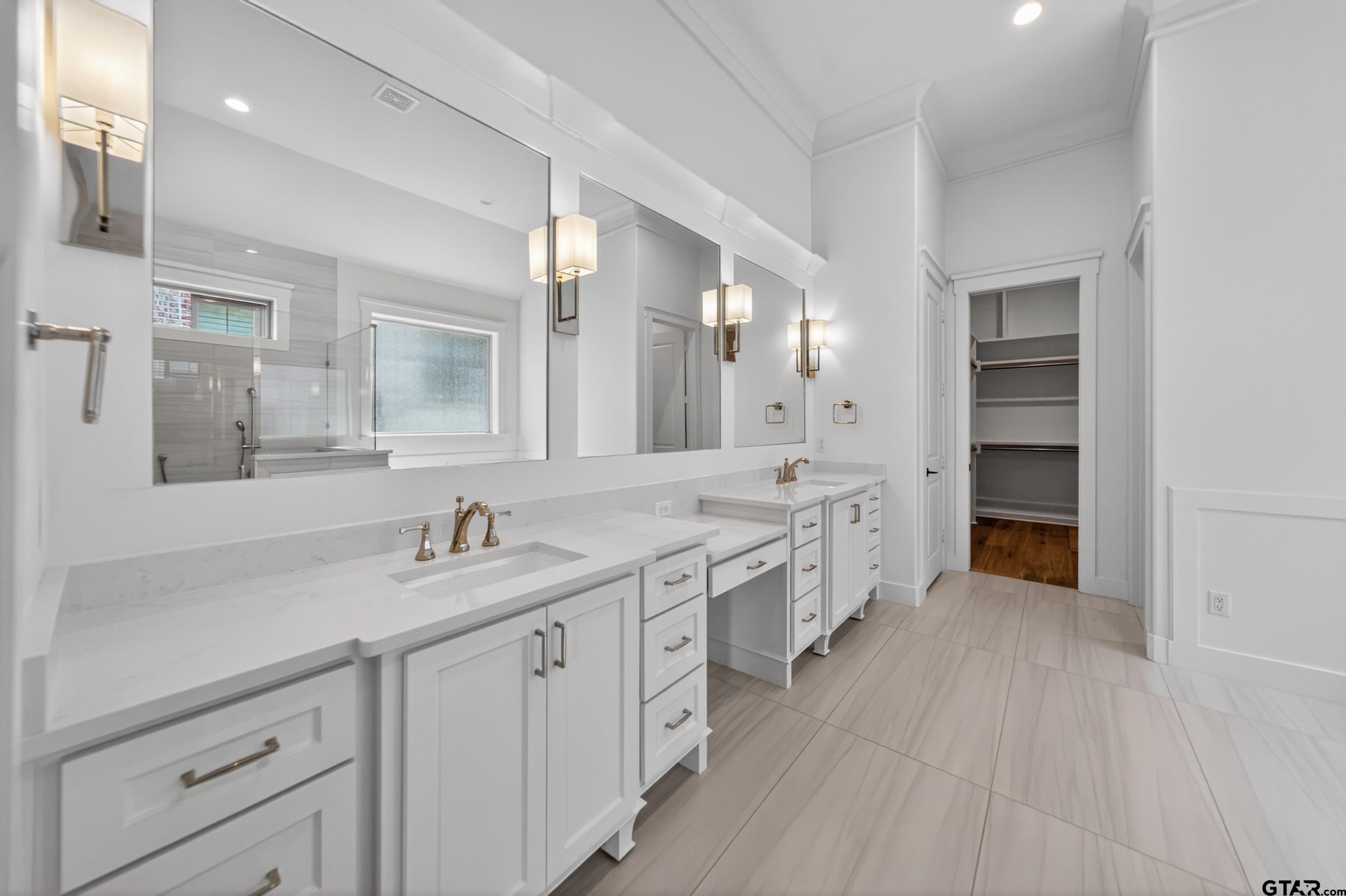7517 Cross Gate Way Tyler, TX 75703 - Photo 16 of 47 a spacious bathroom with a double vanity sink a mirror and a shower