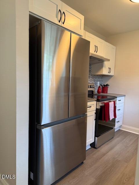 415 Sowell Street Durham, NC 27701 - Photo 8 of 17 a kitchen with stainless steel appliances granite countertop a refrigerator and a sink