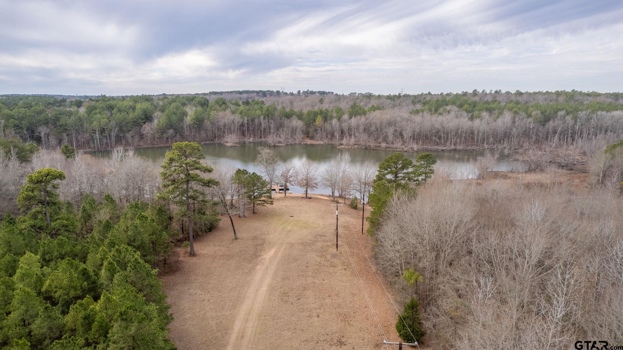 10351 County Road 383 Tyler, TX 75708 - Photo 15 of 33 a view of a lake with houses in back