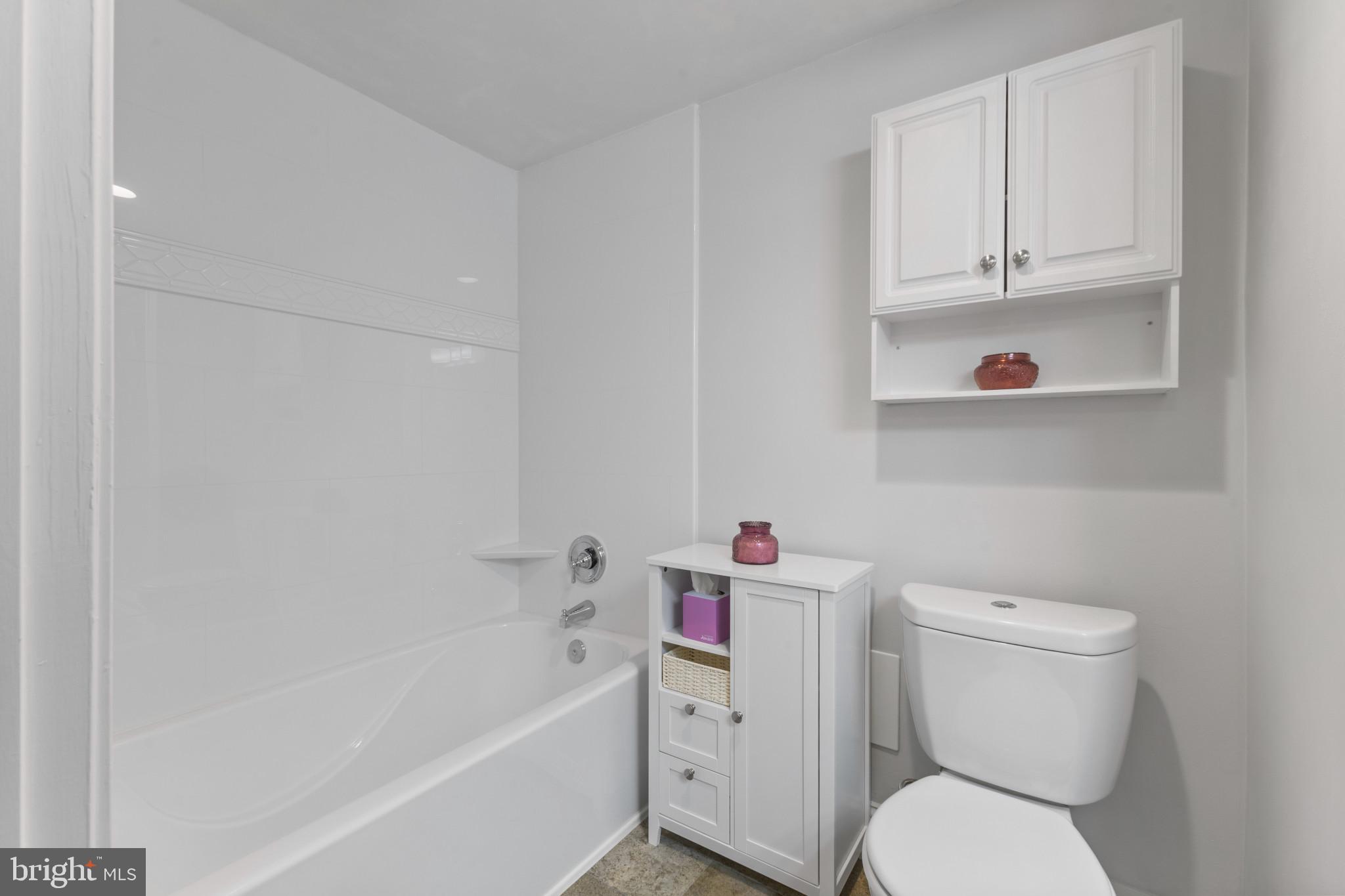 4600 Duke Street, Unit 613 Alexandria, VA 22304 - Photo 18 of 32 a white toilet sitting next to a bath tub